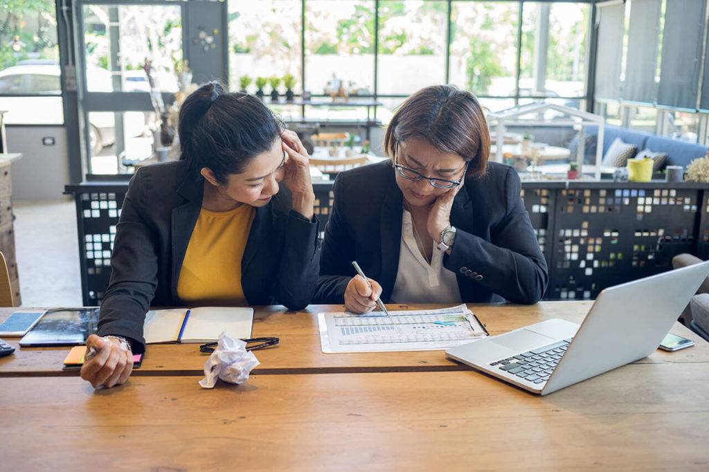 two female professionals working together